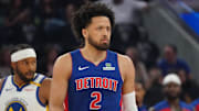 Mar 8, 2025; San Francisco, California, USA; Detroit Pistons guard Cade Cunningham (2) and Golden State Warriors guard Moses Moody (4) wait for play to resume in the first quarter at Chase Center. Mandatory Credit: David Gonzales-Imagn Images