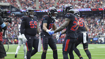 Oct 6, 2024; Houston, Texas, USA; Houston Texans running back Cam Akers (22) celebrates with wide receiver Xavier Hutchinson (19) after scoring a touchdown during the first quarter against the Buffalo Bills at NRG Stadium. Mandatory Credit: Troy Taormina-Imagn Images