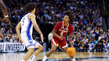 Mar 29, 2025; Newark, NJ, USA; Alabama Crimson Tide guard Labaron Philon (0) handles the ball against Duke Blue Devils guard Tyrese Proctor (5) during the second half in the East Regional final of the 2025 NCAA tournament at Prudential Center. Mandatory Credit: Vincent Carchietta-Imagn Images