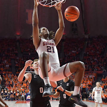 Feb 15, 2025; Champaign, Illinois, USA;  Illinois Fighting Illini forward Morez Johnson Jr. (21) dunks the ball during the second half at State Farm Center. Mandatory Credit: Ron Johnson-Imagn Images