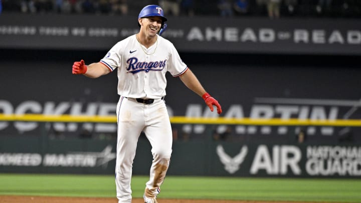 Aug 21, 2024; Arlington, Texas, USA; Texas Rangers left fielder Wyatt Langford (36) celebrates after driving in the game winning run by pinch runner Ezequiel Duran (not pictured) against the Pittsburgh Pirates during the ninth inning at Globe Life Field. Mandatory Credit: Jerome Miron-USA TODAY Sports