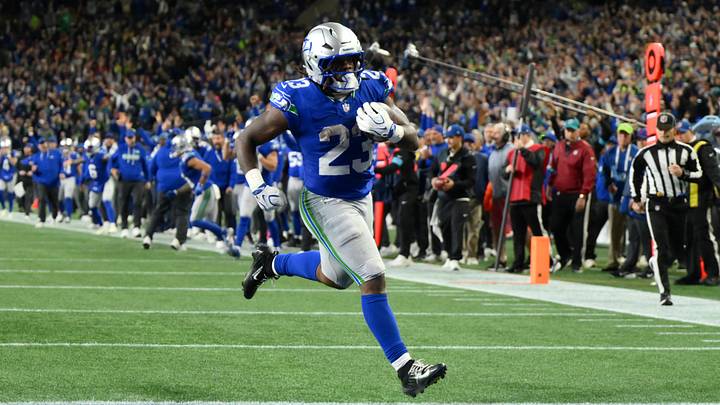 Oct 25, 2026; Seattle, Washington, USA;  Seattle Seahawks running back Emanuel Wilson (23) carries the ball for a touchdown against the Kansas City Chiefs during the fourth quarter at Lumen Field.  Mandatory Credit: Steven Bisig-Imagn Images