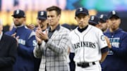 Seattle Mariners former outfielder Ichiro Suzuki, right, stands next to general manager Jerry Dipoto as he is introduced during a ceremony honoring him with the franchise achievement award before a game against the Chicago White Sox at T-Mobile Park on 2019.
