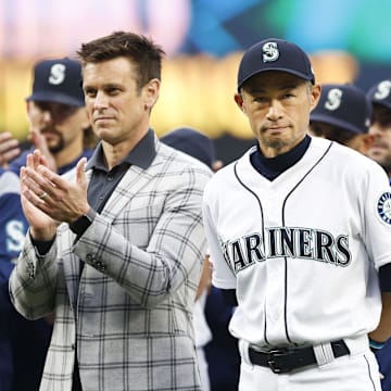 Seattle Mariners former outfielder Ichiro Suzuki, right, stands next to general manager Jerry Dipoto as he is introduced during a ceremony honoring him with the franchise achievement award before a game against the Chicago White Sox at T-Mobile Park on 2019.