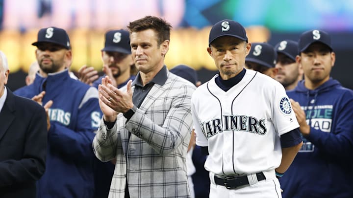 Seattle Mariners former outfielder Ichiro Suzuki, right, stands next to general manager Jerry Dipoto as he is introduced during a ceremony honoring him with the franchise achievement award before a game against the Chicago White Sox at T-Mobile Park on 2019.