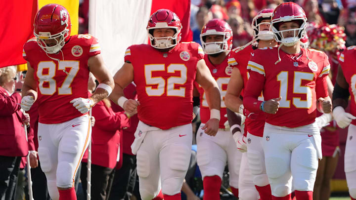 Nov 23, 2025; Kansas City, Missouri, USA; Kansas City Chiefs tight end Travis Kelce (87) and center Creed Humphrey (52) and quarterback Patrick Mahomes (15) run onto the field before the game against the Indianapolis Colts at GEHA Field at Arrowhead Stadium.