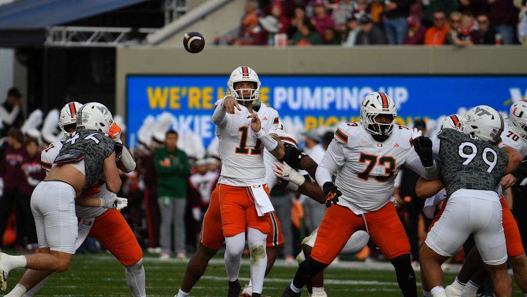Nov 22, 2025; Blacksburg, Virginia, USA; Miami (FL) Hurricanes quarterback Carson Beck (11) throws a pass against the Virginia Tech Hokies during the second quarter at Lane Stadium. Mandatory Credit: Brian Bishop-Imagn Images