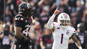 Nov 15, 2025; Cincinnati, Ohio, USA;  Arizona Wildcats quarterback Noah Fifita (1) reacts to throwing a touchdown against the Cincinnati Bearcats in the second half at Nippert Stadium. Mandatory Credit: Aaron Doster-Imagn Images