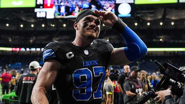 Detroit Lions defensive end Aidan Hutchinson (97) waves at fans after 24-9 win over Tampa Bay Buccaneers at Ford Field in Detroit on Monday, Oct. 20, 2025.