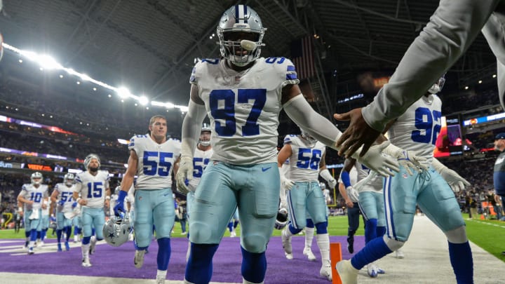 Minneapolis, Minnesota, USA; Dallas Cowboys defensive tackle Osa Odighizuwa (97) and teammates head for the locker room before the game against the Minnesota Vikings at U.S. Bank Stadium. 