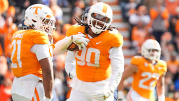 Tennessee defensive lineman Dominic Bailey (90) celebrates with Tennessee defensive lineman Omari Thomas (21) after recovering the ball during a NCAA football game between Tennessee and UTEP in Neyland Stadium on Saturday, November 23, 2024.
