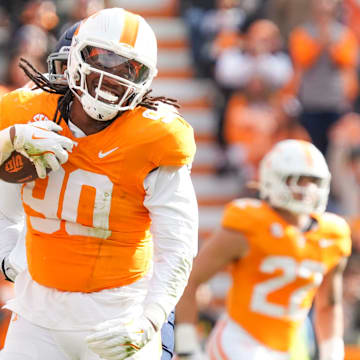 Tennessee defensive lineman Dominic Bailey (90) celebrates with Tennessee defensive lineman Omari Thomas (21) after recovering the ball during a NCAA football game between Tennessee and UTEP in Neyland Stadium on Saturday, November 23, 2024.