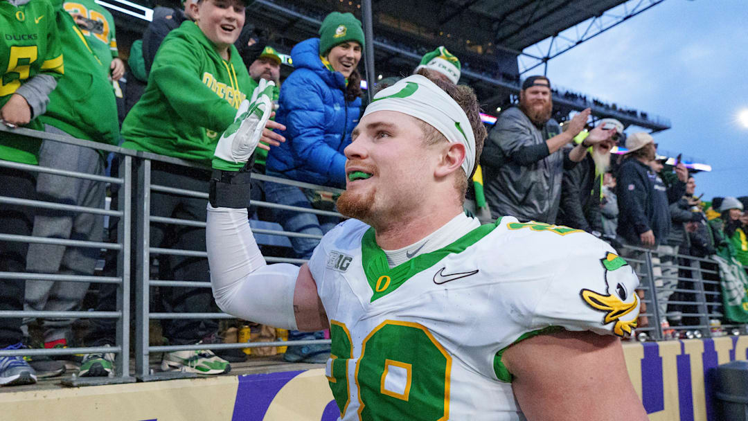 Oregon inside linebacker Bryce Boettcher celebrates after the game as the Oregon Ducks take on the Washington Huskies on Nov. 29, 2025, at Husky Stadium in Seattle, Washington. Oregon inside linebacker Bryce Boettcher celebrates after the game as the Oregon Ducks take on the Washington Huskies on Nov. 29, 2025, at Husky Stadium in Seattle, Washington.