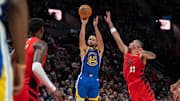 Oct 23, 2024; Portland, Oregon, USA; Golden State Warriors point guard Stephen Curry (30) shoots the ball against Portland Trailblazers forward Toumani Camara (33) during the second half at Moda Center. Mandatory Credit: Stephen Brashear-Imagn Images