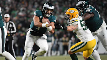 Jan 12, 2025; Philadelphia, Pennsylvania, USA; Philadelphia Eagles quarterback Jalen Hurts (1) rushes the ball against the Green Bay Packers during the second half in an NFC wild card game at Lincoln Financial Field. Mandatory Credit: Eric Hartline-Imagn Images