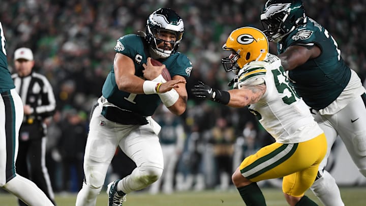 Jan 12, 2025; Philadelphia, Pennsylvania, USA; Philadelphia Eagles quarterback Jalen Hurts (1) rushes the ball against the Green Bay Packers during the second half in an NFC wild card game at Lincoln Financial Field. Mandatory Credit: Eric Hartline-Imagn Images