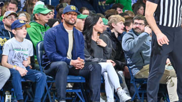 Notre Dame head football coach Marcus Freeman watches basketball