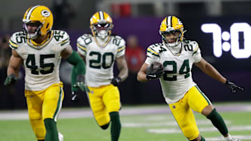 Green Bay Packers cornerback Carrington Valentine (24) runs back an interception against the Minnesota Vikings in the third quarter during their football game Sunday, December 29, 2024, at U.S. Bank Stadium in Minneapolis, Minnesota.