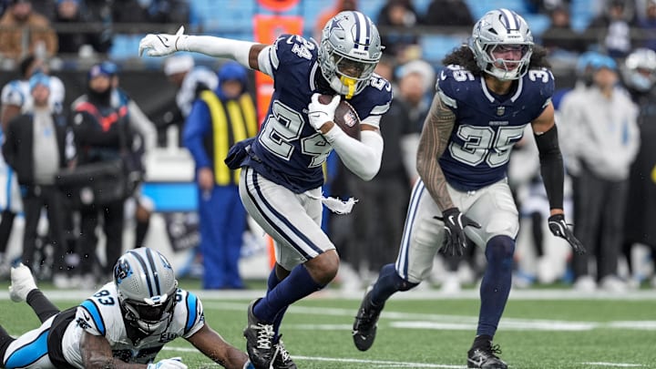 Dallas Cowboys safety Israel Mukuamu runs after intercepting a pass from Carolina Panthers quarterback Bryce Young Dallas Cowboys safety Israel Mukuamu runs after intercepting a pass from Carolina Panthers quarterback Bryce Young