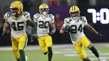 Dec 29, 2024; Minneapolis, Minnesota, USA; Green Bay Packers cornerback Carrington Valentine (24) runs back an interception against the Minnesota Vikings in the third quarter at U.S. Bank Stadium. Mandatory Credit: Dan Powers/USA TODAY NETWORK-Wisconsin via Imagn Images