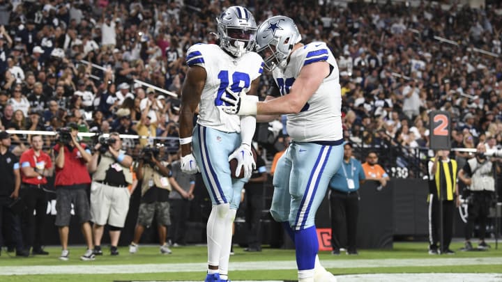 Aug 17, 2024; Paradise, Nevada, USA; Dallas Cowboys wide receiver Ryan Flournoy (18) celebrates scoring a touchdown with offensive tackle Matt Waletzko (79) in the second quarter against the Las Vegas Raiders at Allegiant Stadium. 