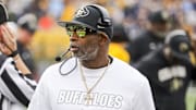 Nov 8, 2025; Morgantown, West Virginia, USA; Colorado Buffaloes head coach Deion Sanders walks along the sidelines late in the fourth quarter against the West Virginia Mountaineers at Milan Puskar Stadium.