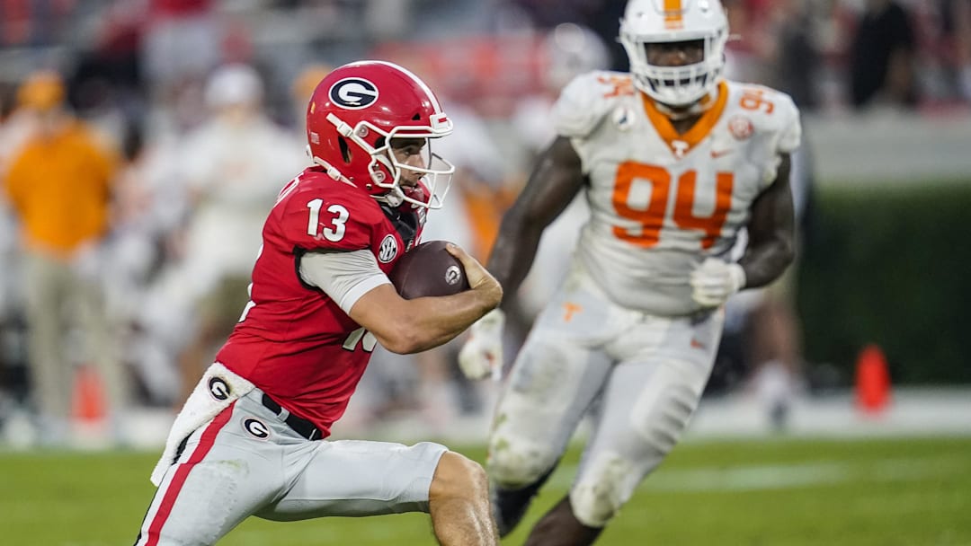 Oct 10, 2020; Athens, Georgia, USA; Georgia Bulldogs quarterback Stetson Bennett (13) runs with the ball against the Tennessee Volunteers during the second half at Sanford Stadium. Mandatory Credit: Dale Zanine-Imagn Images Oct 10, 2020; Athens, Georgia, USA; Georgia Bulldogs quarterback Stetson Bennett (13) runs with the ball against the Tennessee Volunteers during the second half at Sanford Stadium. Mandatory Credit: Dale Zanine-Imagn Images
