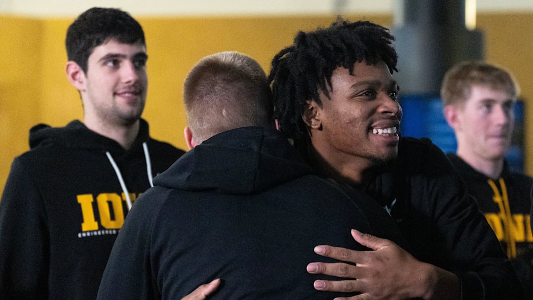 Iowa’s Tavion Banks hugs Iowa guard Bennett Stirtz after the Iowa Hawkeyes’ are announced as a 9-seed in the NCAA Tournament March 15, 2026 at Carver-Hawkeye Arena in Iowa City, Iowa.