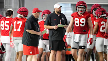 Ohio State Buckeyes offensive line coach Tyler Bowen, middle, and assistant Charlie Dickey, left, watch during spring football practice at the Woody Hayes Athletic Center on March 17, 2025.