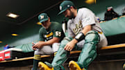 Sep 20, 2025; Pittsburgh, Pennsylvania, USA; Athletics catcher Shea Langeliers (23) prepares in the dugout alongside coach Ramon Hernandez (55) to play the Pittsburgh Pirates at PNC Park. Mandatory Credit: Charles LeClaire-Imagn Images