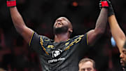 Dec 16, 2023; Las Vegas, Nevada, USA; Leon Edwards (red gloves) reacts after defeating Colby Covington (blue gloves) to retain the UFC welterweight title during UFC 296 at T-Mobile Arena. Mandatory Credit: Stephen R. Sylvanie-Imagn Images