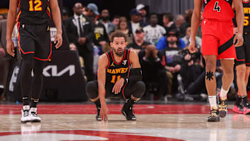 Trae Young (11) reacts after a miss against the Toronto Raptors