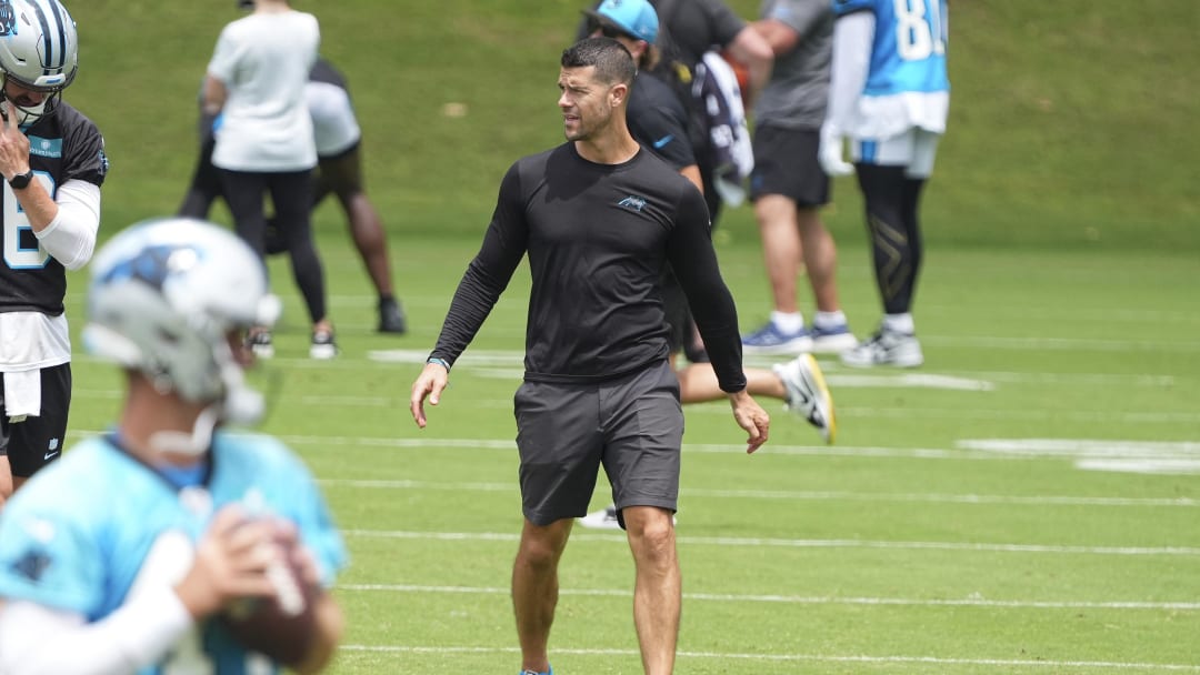 Jun 4, 2024; Charlotte, NC, USA; Carolina Panthers Head Coach Dave Canales looks at his offensive backfield during OTAs. Mandatory Credit: Jim Dedmon-USA TODAY Sports
