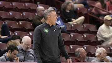 Nov 19, 2023; Charleston, SC, USA; Current WVU and former North Texas head coach Ross Hodge reacts to a call on the court in the first half against the Towson Tigers at TD Arena. Mandatory Credit: David Yeazell-Imagn Images