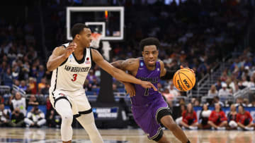 Mar 18, 2023; Orlando, FL, USA; Furman Paladins guard JP Pegues (1) drives against San Diego State Aztecs guard Micah Parrish (3) during the second half in the second round of the 2023 NCAA Tournament at Legacy Arena. Mandatory Credit: Matt Pendleton-USA TODAY Sports
