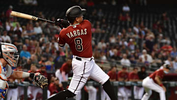 Jun 2, 2021; Phoenix, Arizona, USA; Arizona Diamondbacks infielder Ildemaro Vargas (8) hits a two-RBI single in the first inning against the New York Mets at Chase Field. Mandatory Credit: Matt Kartozian-Imagn Images
