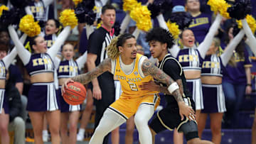 Kent State Golden Flashes guard Marquis Barnett (2) looks to get around Akron Zips guard Sharron Young (3) during the first half of an NCAA college basketball game on Friday, Jan. 31, 2025, in Kent, Ohio.