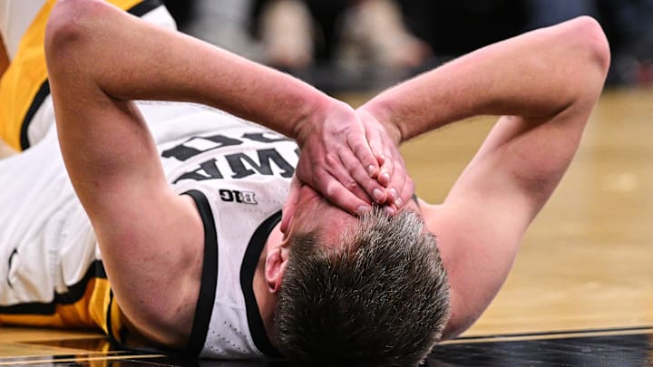 Feb 19, 2025; Iowa City, Iowa, USA; Iowa Hawkeyes forward Payton Sandfort (20) reacts on the court after the game against the Oregon Ducks at Carver-Hawkeye Arena. Mandatory Credit: Jeffrey Becker-Imagn Images