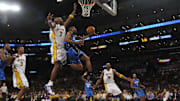 Orlando's Rafer Alston drives for a layup against Lakers Lamar Odom with Kobe Bryant looking on during Game 2 of the 2009 NBA Finals at the Staples Center in Los Angeles. 