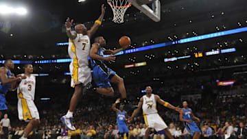Orlando's Rafer Alston drives for a layup against Lakers Lamar Odom with Kobe Bryant looking on during Game 2 of the 2009 NBA Finals at the Staples Center in Los Angeles. 