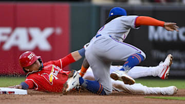 May 2, 2025; St. Louis, Missouri, USA;  St. Louis Cardinals shortstop Masyn Winn (0) is tagged out by New York Mets second baseman Luisangel Acuna (2) on a stolen base attempt during the first inning at Busch Stadium. Mandatory Credit: Jeff Curry-Imagn Images