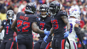 Houston Texans quarterback C.J. Stroud celebrates with running back Cam Akers