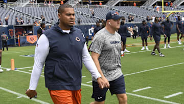 Aug 26, 2023; Chicago, Illinois, USA;  Chicago Bears General Manager Ryan Poles, left, and Luke Getsy, Offensive Coordinator walk the field  before the team s game against the Buffalo Bills at Soldier Field. Mandatory Credit: Matt Marton-Imagn Images