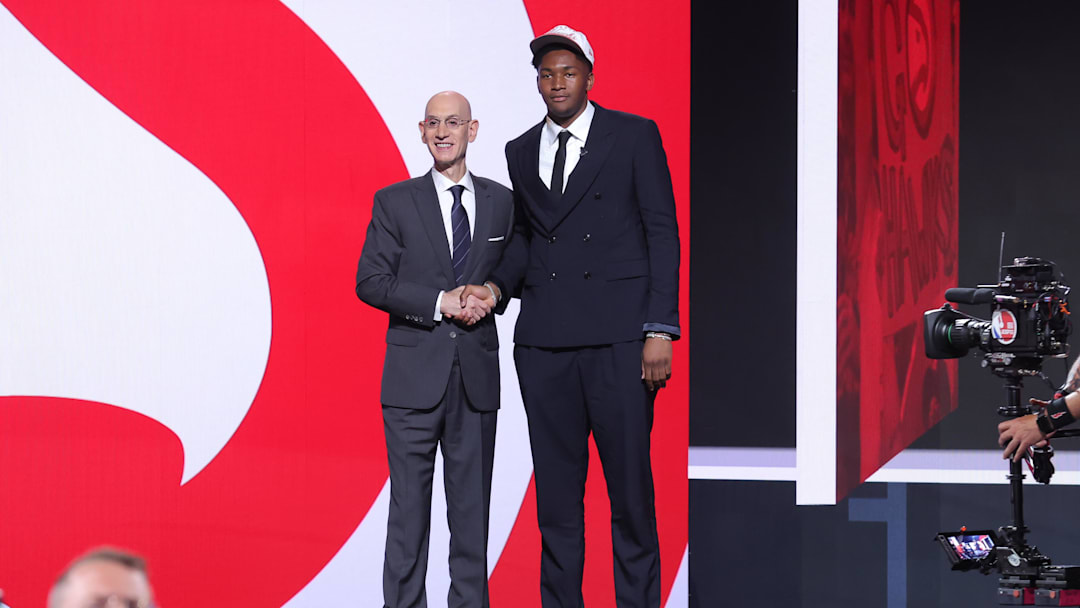 Jun 25, 2025; Brooklyn, NY, USA;  Derik Queen stands with NBA commissioner Adam Silver after being selected as the 13th pick by the Atlanta Hawks in the first round of the 2025 NBA Draft at Barclays Center. Mandatory Credit: Brad Penner-Imagn Images