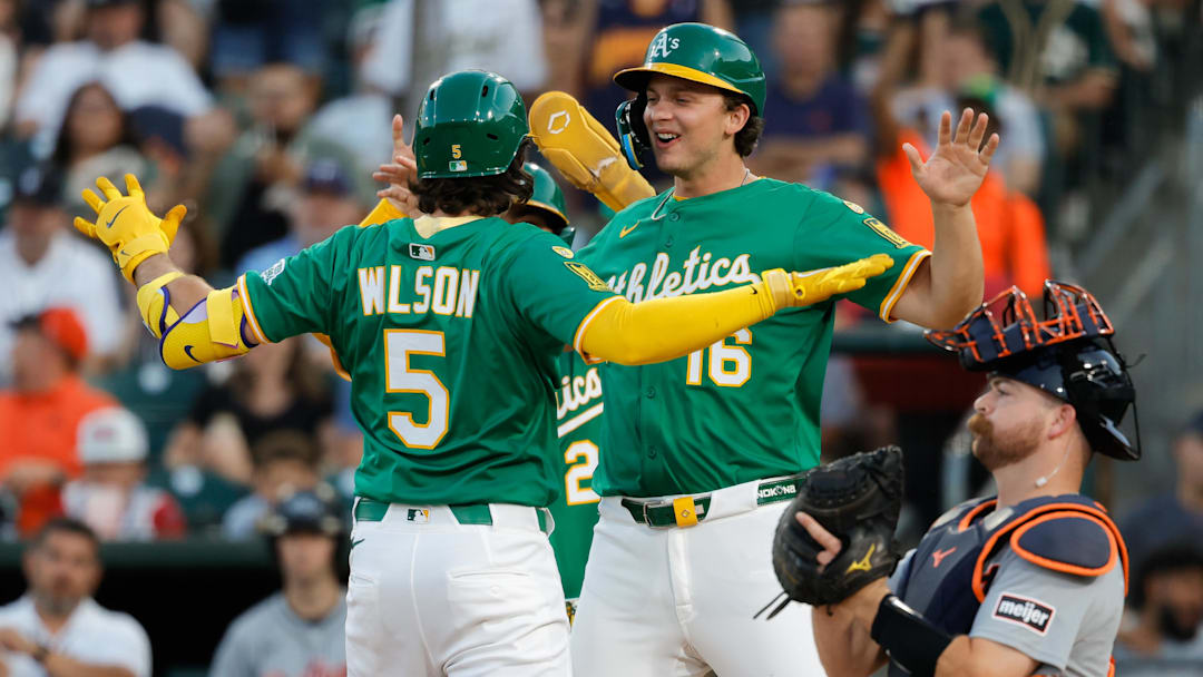 Aug 26, 2025; West Sacramento, California, USA; Athletics shortstop Jacob Wilson (5), left, celebrates with first baseman Nick Kurtz (16) at home plate after hitting a three run home run during the first inning against the Detroit Tigers at Sutter Health Park. Mandatory Credit: Sergio Estrada-Imagn Images