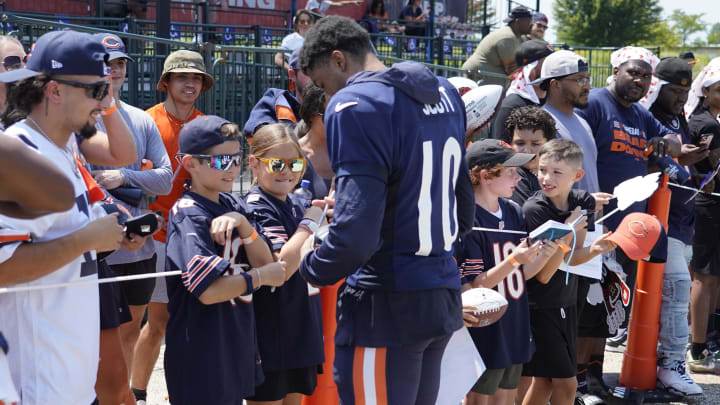 Jul 27, 2024; Lake Forest, IL, USA; Chicago Bears wide receiver Tyler Scott (10) signs autographs during Chicago Bears Training Camp at Halas Hall. Mandatory Credit: David Banks-USA TODAY Sports