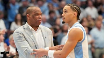 Mar 8, 2025; Chapel Hill, North Carolina, USA;  North Carolina Tar Heels head coach Hubert Davis with guard Seth Trimble (7) in the second half at Dean E. Smith Center. Mandatory Credit: Bob Donnan-Imagn Images