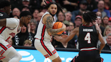 Houston guard Emanuel Sharp (with ball)