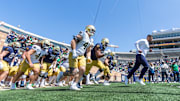 Apr 12, 2025; Notre Dame, IN, USA; Notre Dame Fighting Irish head coach Marcus Freeman leads the team onto the field during the Blue-Gold game at Notre Dame Stadium. Mandatory Credit: Michael Caterina-Imagn Images