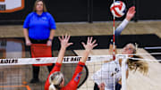 Notre Dame's Teagan Kondik (1) hits the ball against St. Henry in the third set of the Ninth Region volleyball final at Ryle High School Oct. 29, 2025.